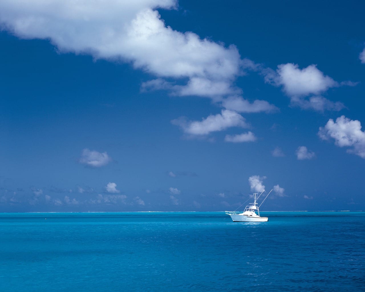Photo of single boat on blue ocean - strategy concept