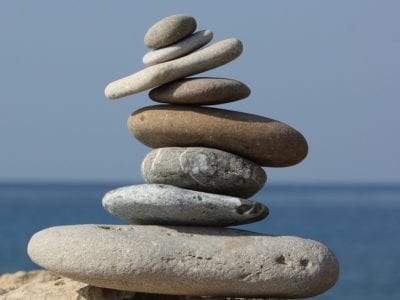 Photo of balancing stones for balance in business of lifelong learning concept