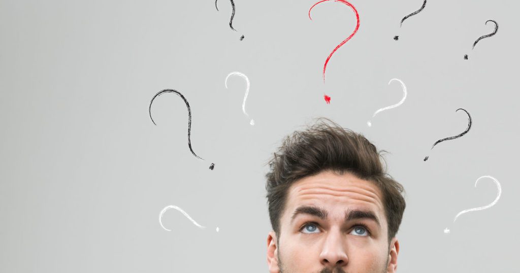 Top half of man's head surrounded by question marks for presentation skills training FAQ